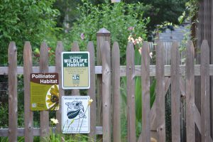 fence with bird habitat sign