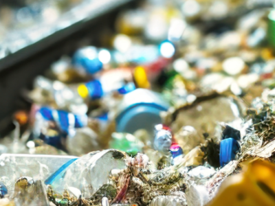 image of plastics and cans on a conveyor belt for recxycling