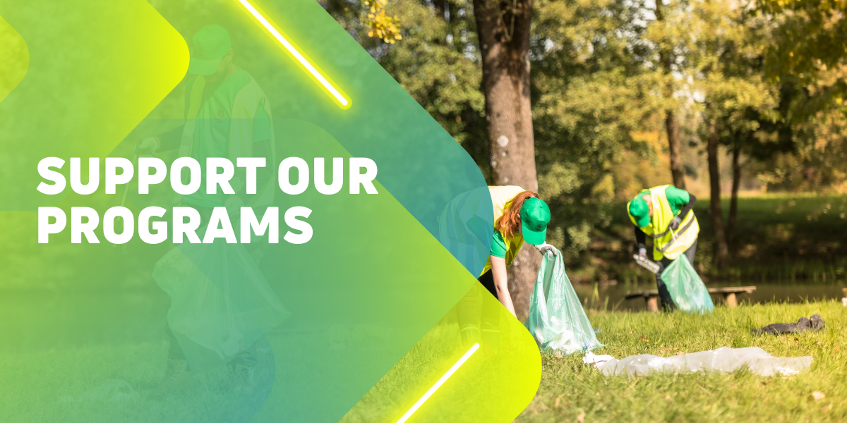 Support Our Programs, image of volunteers picking up trash from grassy ground with trees in the background